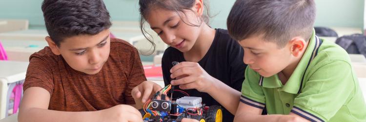 children playing with a robotic toy