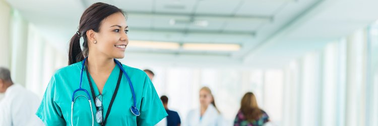 Nurse educator walking down the hallway at a hospital