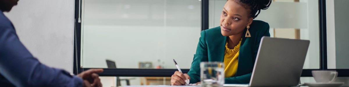 Human resources specialist talking with an employee in a conference room