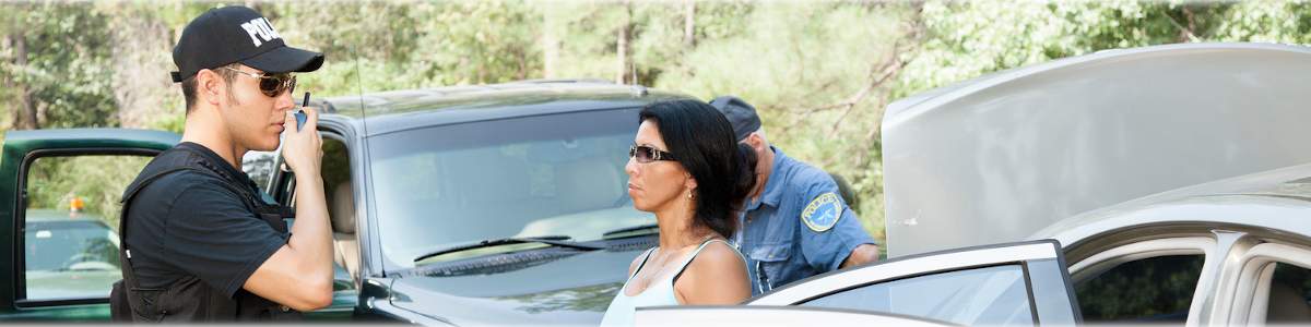 Photo of a law enforcement officer talking on a walkie talkie